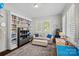 Charming office space with custom built-ins, a large bookshelf, and lots of natural light at 309 Catawba Ave, Davidson, NC 28036