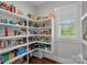Walk-in pantry with ample shelving, providing abundant storage space and a window for natural light at 309 Catawba Ave, Davidson, NC 28036