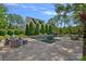 Backyard featuring a rectangular pool, patio seating, and lush landscaping create a serene outdoor retreat at 309 Catawba Ave, Davidson, NC 28036