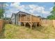 Exterior view of the new construction home, back deck and fenced yard at 320 Evans Nw St, Concord, NC 28027