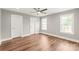 Spacious bedroom with hardwood floors, neutral paint, ceiling fan and ample natural light at 320 Evans Nw St, Concord, NC 28027