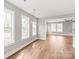 Bright dining room with an open floor plan featuring hardwood floors and neutral colors at 320 Evans Nw St, Concord, NC 28027