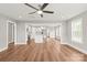 Open-concept living space seamlessly connecting the living room, dining area, and modern kitchen at 320 Evans Nw St, Concord, NC 28027