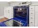 New oven with a blue interior, and stainless steel fixtures at 320 Evans Nw St, Concord, NC 28027