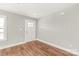 Versatile room with modern flooring, white walls, and natural light, ready for personalization at 320 Evans Nw St, Concord, NC 28027