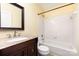 Full bathroom with granite vanity, wooden cabinet, and tiled shower-tub combination at 3200 Tallia Ct, Charlotte, NC 28269