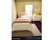 Bright bedroom with a large window, stylish bed and white dresser at 3200 Tallia Ct, Charlotte, NC 28269