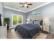 Cozy bedroom features a large window, ceiling fan and modern decor for a relaxing retreat at 3200 Tallia Ct, Charlotte, NC 28269