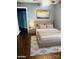 Cozy bedroom featuring a tufted headboard, neutral color scheme, and stylish rug at 3200 Tallia Ct, Charlotte, NC 28269