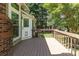 Deck with wood railing, open door and backyard views at 3200 Tallia Ct, Charlotte, NC 28269