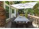 Outdoor patio featuring a dining table under an umbrella, ideal for outdoor entertaining at 3200 Tallia Ct, Charlotte, NC 28269