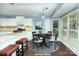 Inviting eat-in kitchen with white cabinets, granite countertops, and stainless steel appliances at 3200 Tallia Ct, Charlotte, NC 28269
