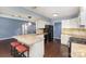 Open kitchen featuring a large island, white cabinets, and modern appliances; great for cooking at 3200 Tallia Ct, Charlotte, NC 28269