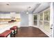 Inviting eat-in kitchen with white cabinets, granite countertops, and stainless steel appliances at 3200 Tallia Ct, Charlotte, NC 28269