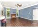 Bright living room featuring a fireplace, ceiling fan, and neutral decor; ready for furnishings at 3200 Tallia Ct, Charlotte, NC 28269