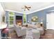 Bright living room featuring a fireplace, ceiling fan, and neutral decor; perfect for relaxation at 3200 Tallia Ct, Charlotte, NC 28269