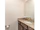 Bathroom with granite countertop, undermount sink, wood vanity, and modern fixtures at 323 Cheshire Ln, Fort Mill, SC 29707
