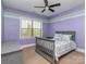 Charming bedroom featuring soft purple walls and a ceiling fan for added comfort at 323 Cheshire Ln, Fort Mill, SC 29707