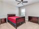 Cozy bedroom featuring a classic bed frame, matching dressers, and a window with natural light at 323 Cheshire Ln, Fort Mill, SC 29707