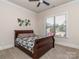 Cozy bedroom featuring a ceiling fan and a window with a view to the outside at 323 Cheshire Ln, Fort Mill, SC 29707