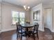 Inviting dining room with large windows and stylish chandelier, great for gatherings at 323 Cheshire Ln, Fort Mill, SC 29707
