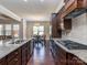 Spacious kitchen with granite countertops, stainless steel appliances, and open view to the dining area at 323 Cheshire Ln, Fort Mill, SC 29707