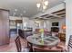 Open-concept kitchen and dining area with granite countertops, stainless steel appliances, and great flow at 323 Cheshire Ln, Fort Mill, SC 29707