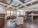 Inviting living room with a coffered ceiling, stone fireplace and hardwood floors at 323 Cheshire Ln, Fort Mill, SC 29707