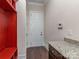 Practical mudroom features built-in storage, a granite countertop, and easy access to the outdoors at 323 Cheshire Ln, Fort Mill, SC 29707