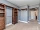 Spacious walk-in closet with custom wood shelving and ample hanging space, providing optimal storage solutions at 323 Cheshire Ln, Fort Mill, SC 29707