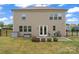 Backyard view includes a grill, patio, and a well-maintained lawn enclosed by a fence at 341 Pleasant Hill Se Dr, Concord, NC 28025