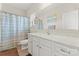 Well-lit bathroom showcasing a vanity with marble countertops, toilet, and a shower with curtain at 341 Pleasant Hill Se Dr, Concord, NC 28025