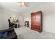 Multi-functional bonus room with a comfortable seating area and a dedicated workspace at 341 Pleasant Hill Se Dr, Concord, NC 28025