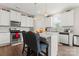 Stylish kitchen with white cabinetry, an island with seating, stainless steel appliances, and subway tile backsplash at 341 Pleasant Hill Se Dr, Concord, NC 28025