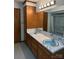 Traditional bathroom featuring a double sink, tiled floor, and blue accents at 370 Sherrill Farm Rd, Lincolnton, NC 28092