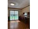 Inviting dining area featuring wood floors, a bar counter with seating, and sliding glass doors to the backyard at 370 Sherrill Farm Rd, Lincolnton, NC 28092