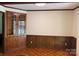 Classic dining room featuring beautiful wood trim, wainscoting, and a built-in glass-front cabinet at 370 Sherrill Farm Rd, Lincolnton, NC 28092