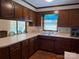 Classic kitchen features wood cabinets, ample counter space, and a view to the sunroom at 370 Sherrill Farm Rd, Lincolnton, NC 28092