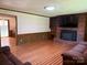 Spacious living room features a brick fireplace and hardwood floors at 370 Sherrill Farm Rd, Lincolnton, NC 28092