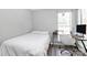 Bedroom featuring a bed, desk, hardwood floors, and natural light at 4606 Falcon Chase Sw Dr, Concord, NC 28027