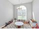 Bright bonus room featuring natural light from a large window and decorative chandelier at 4606 Falcon Chase Sw Dr, Concord, NC 28027