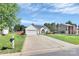 Inviting single-story home with a well-kept lawn, long driveway, and a mailbox at 4606 Falcon Chase Sw Dr, Concord, NC 28027