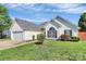 Charming single-story home featuring a well-manicured front yard and attached garage at 4606 Falcon Chase Sw Dr, Concord, NC 28027