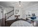 Elegant foyer with hardwood floors, staircase, and an open view to the living room at 4611 Cringle Ct, Charlotte, NC 28226
