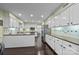 Spacious kitchen with island, stainless steel refrigerator, white cabinetry, and an adjacent dining area at 4611 Cringle Ct, Charlotte, NC 28226