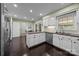 Bright kitchen with white cabinets, stainless steel appliances, and a breakfast nook at 4611 Cringle Ct, Charlotte, NC 28226