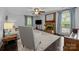 Bright living room with a brick fireplace, plush seating, and natural light from large windows at 4611 Cringle Ct, Charlotte, NC 28226