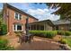 Outdoor patio featuring brick flooring, with table set, and green shrubbery around at 4611 Cringle Ct, Charlotte, NC 28226