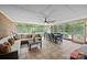 Inviting sunroom features tiled flooring, a dining table, and a comfortable seating area for relaxation at 4611 Cringle Ct, Charlotte, NC 28226