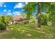 Expansive backyard featuring a patio with gazebo and a tree providing natural shade at 4901 White Oak Rd, Charlotte, NC 28210